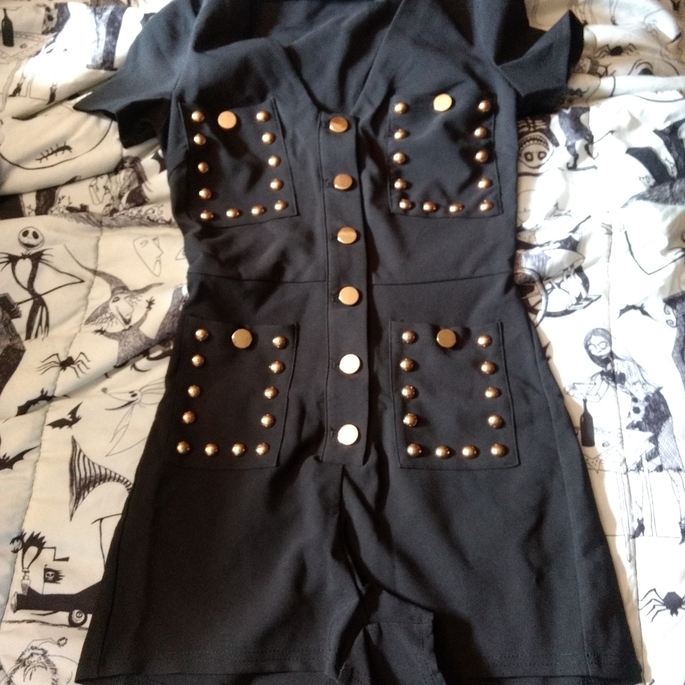 Black romper with studs.
